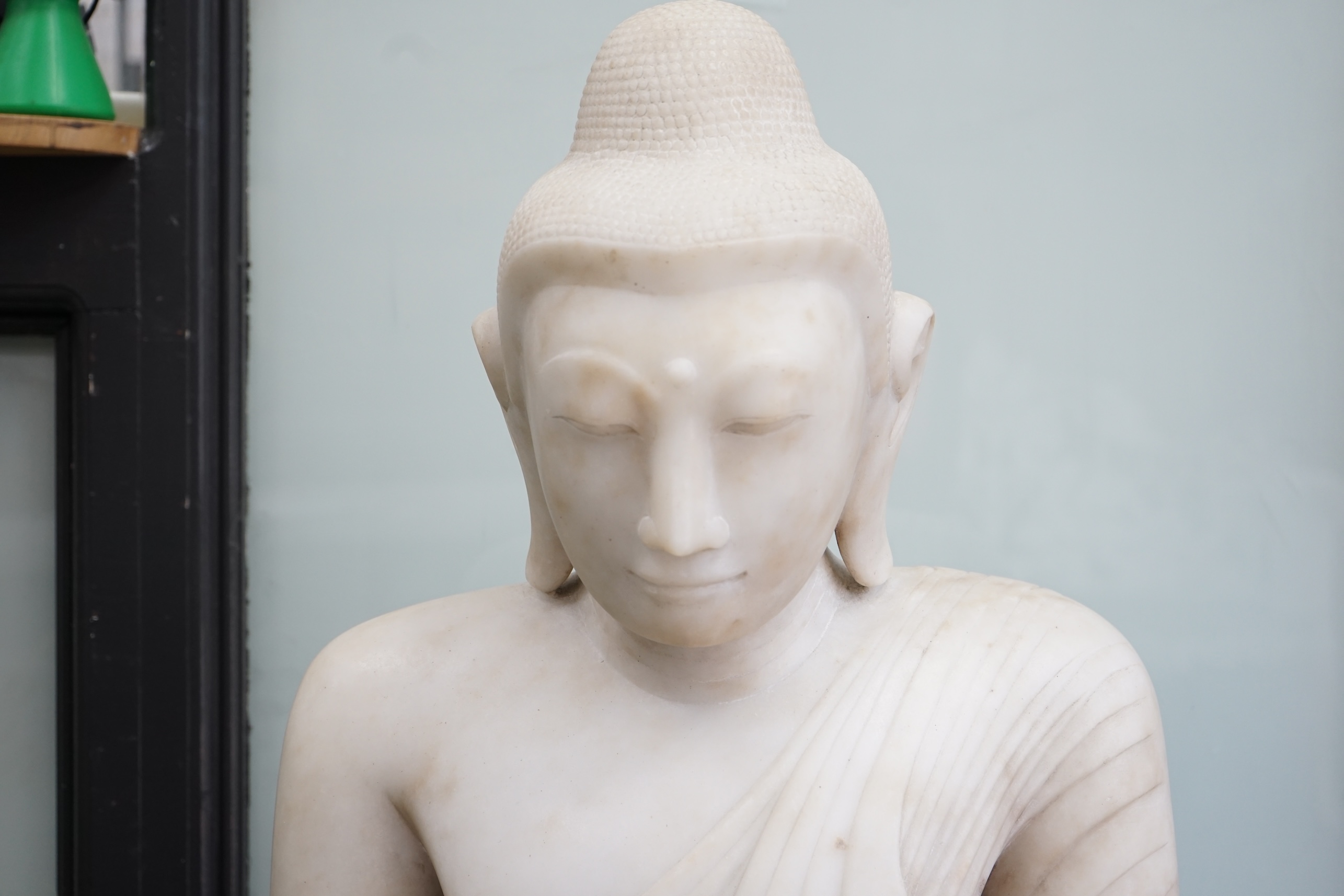 A massive Burmese marble seated figure of Buddha Shakyamuni, 18th/19th century